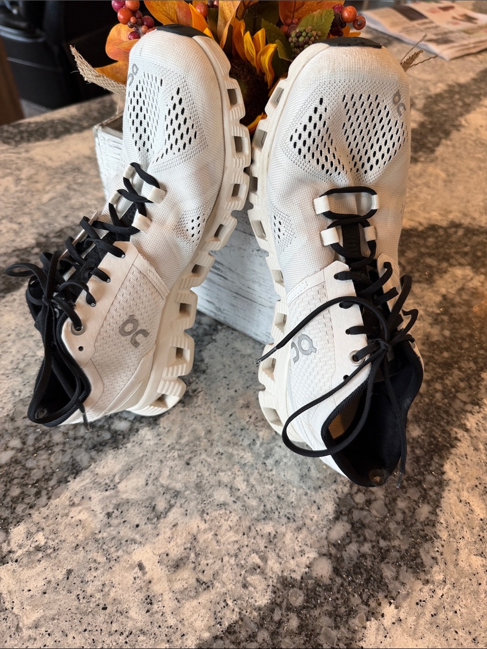On Running women’s Cloud Athletic Shoes in White with Black Accents